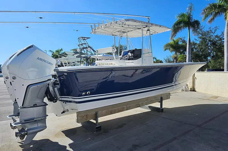  Yacht Photos Pics 2007 SeaCraft SC32 Master Angler boat with Mercury engine, docked under clear blue sky.