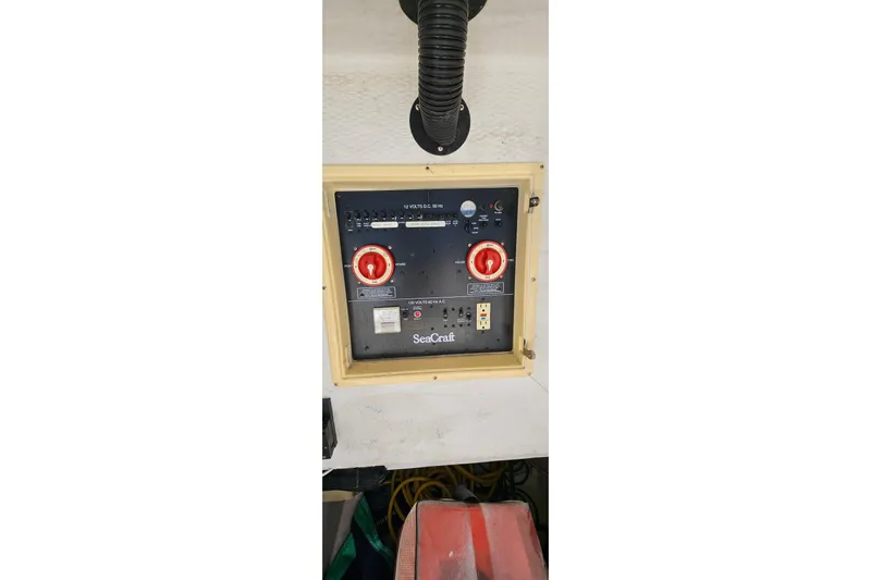  Yacht Photos Pics Control panel of 2007 SeaCraft SC32 Master Angler boat with red switches and labels.
