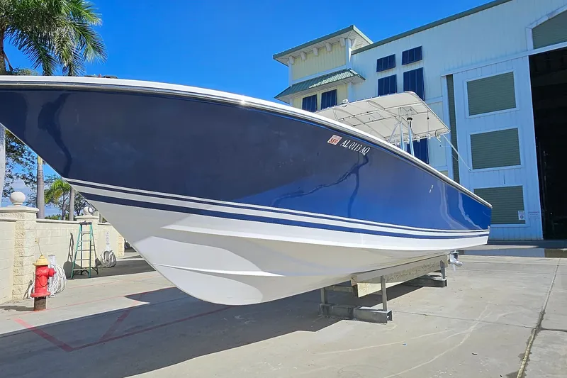  Yacht Photos Pics 2007 SeaCraft SC32 Master Angler boat on display outside a marina building.