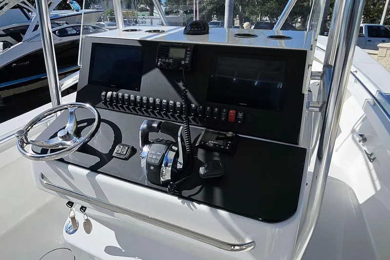  Yacht Photos Pics 2007 SeaCraft SC32 Master Angler boat console with steering wheel and navigation controls.