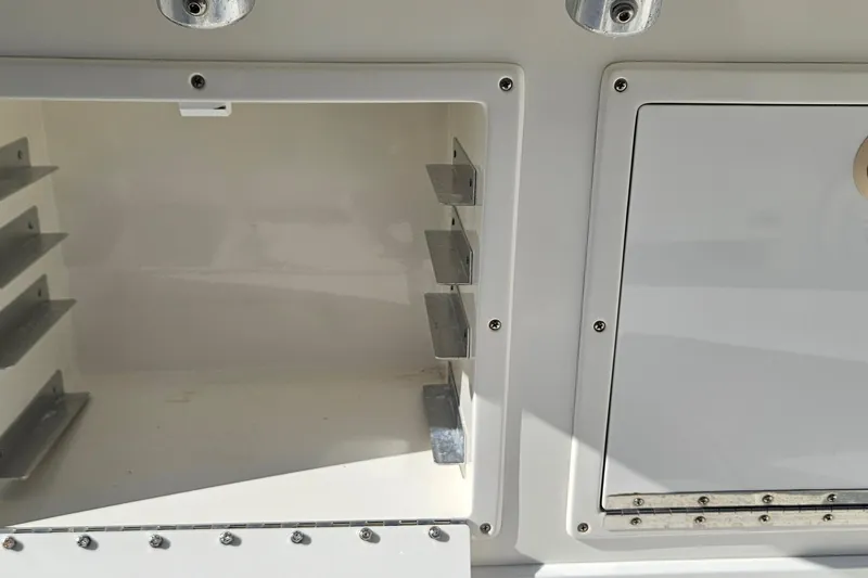  Yacht Photos Pics 2007 SeaCraft SC32 Master Angler storage compartments with metal brackets and secure latches.