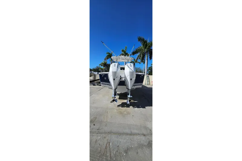  Yacht Photos Pics 2007 SeaCraft SC32 Master Angler boat on trailer, clear sky, palm trees in background.