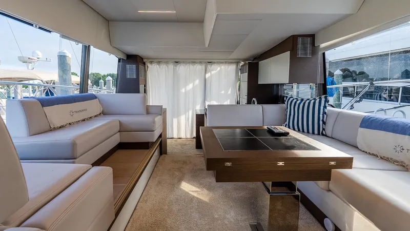  Yacht Photos Pics Luxurious interior of a 2019 Prestige 520 Flybridge yacht with elegant seating and table.