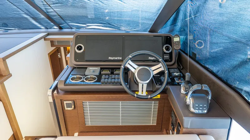  Yacht Photos Pics 2019 Prestige 520 Flybridge helm with Raymarine electronics and modern controls.