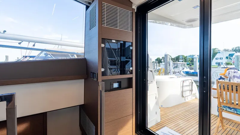  Yacht Photos Pics Interior view of 2019 Prestige 520 Flybridge yacht with outdoor deck and seating area.