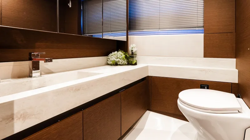  Yacht Photos Pics Luxurious bathroom in 2019 Prestige 520 Flybridge yacht with modern fixtures and elegant design.
