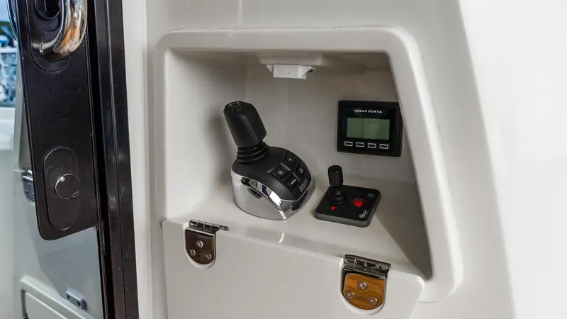  Yacht Photos Pics Control panel of 2019 Prestige 520 Flybridge with joystick and Volvo Penta display.