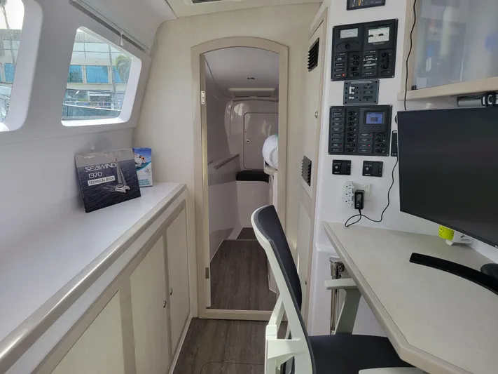  Yacht Photos Pics Interior of 2019 Seawind 1160 Lite catamaran with navigation station.