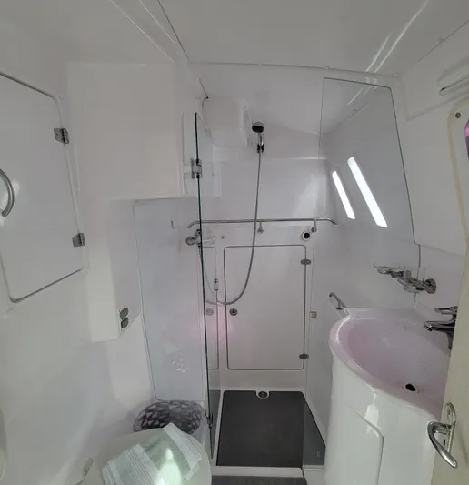  Yacht Photos Pics 2019 Seawind 1160 Lite yacht bathroom with shower, sink, and modern fixtures.