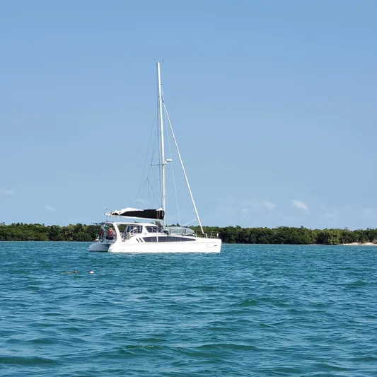  Yacht Photos Pics 2019 Seawind 1160 Lite catamaran sailing on calm blue waters.