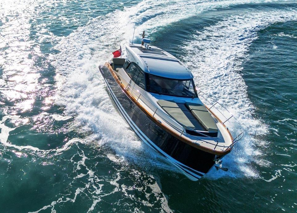 2025 Rustler 41 yacht cruising on open water, creating dynamic waves.