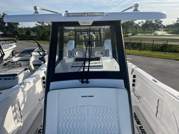  Yacht Photos Pics 2025 Twin Vee 280 GFX2 CC boat, sleek design, parked outdoors.