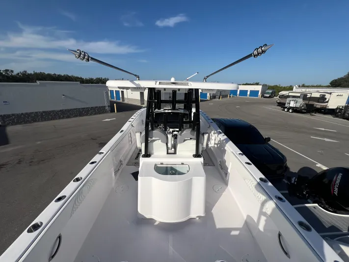  Yacht Photos Pics 2025 Twin Vee 280 GFX2 CC boat with center console in a parking area.