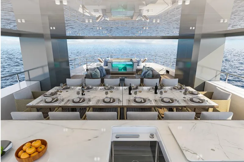 Stella Azura Yacht Photos Pics Luxurious dining area on Falcon Yachts 45, 2026 model, with ocean view and elegant table setting.