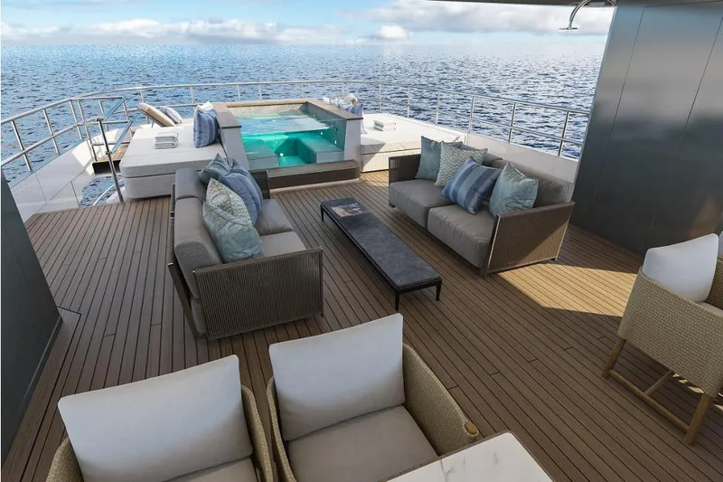 Stella Azura Yacht Photos Pics Luxurious deck of 2026 Falcon Yachts 45 with seating and jacuzzi, overlooking the ocean.