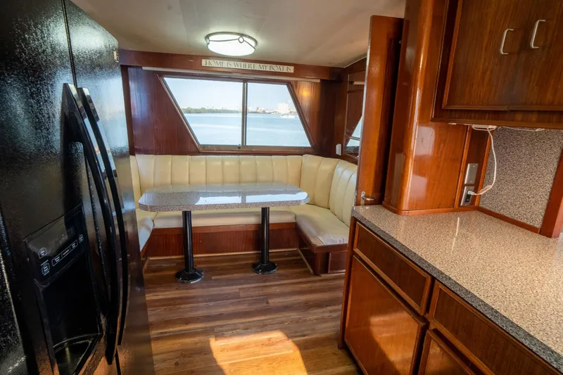 Hattrick Yacht Photos Pics Interior of 1981 Hatteras 61 Cockpit MY yacht with dining area and kitchen.