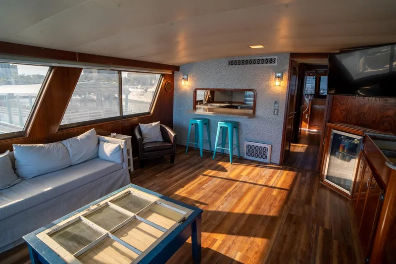 Hattrick Yacht Photos Pics Interior of 1981 Hatteras 61 Cockpit MY yacht with modern decor and wood flooring.