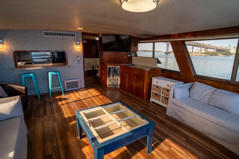 Hattrick Yacht Photos Pics Interior of 1981 Hatteras 61 Cockpit MY yacht with modern decor and waterfront view.