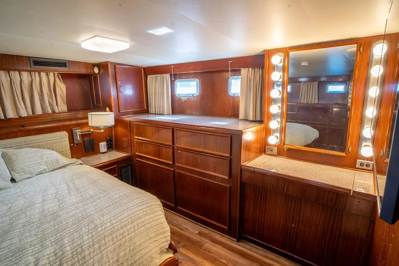 Hattrick Yacht Photos Pics Luxurious 1981 Hatteras 61 Cockpit MY cabin with wood paneling and vanity mirror.