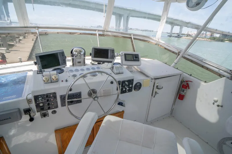 Hattrick Yacht Photos Pics Cockpit of 1981 Hatteras 61 Cockpit MY yacht with navigation equipment and bridge view.