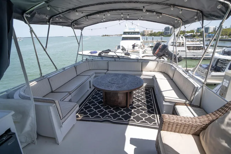 Hattrick Yacht Photos Pics Spacious deck of 1981 Hatteras 61 Cockpit MY yacht with seating and table.