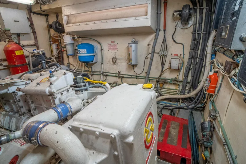 Hattrick Yacht Photos Pics Engine room of 1981 Hatteras 61 Cockpit MY yacht, showcasing machinery and equipment.
