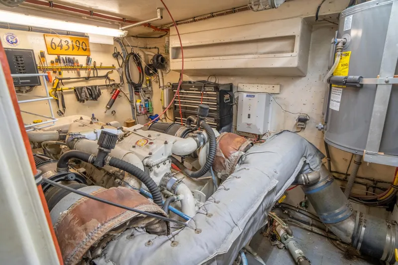 Hattrick Yacht Photos Pics Engine room of 1981 Hatteras 61 Cockpit MY yacht, featuring tools and equipment.