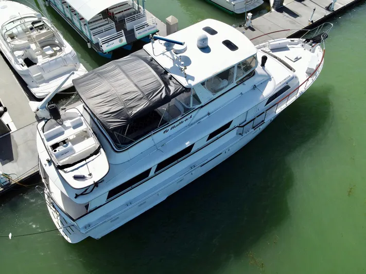 Hattrick Yacht Photos Pics 1981 Hatteras 61 Cockpit MY yacht docked at marina, aerial view.
