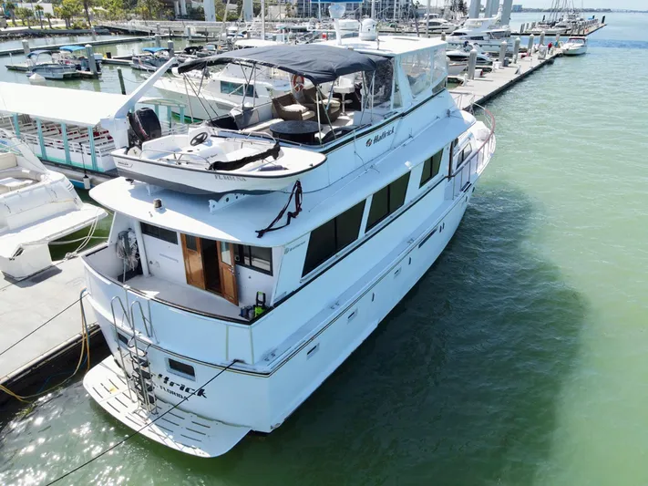Hattrick Yacht Photos Pics 1981 Hatteras 61 Cockpit MY yacht docked at marina, aerial view.