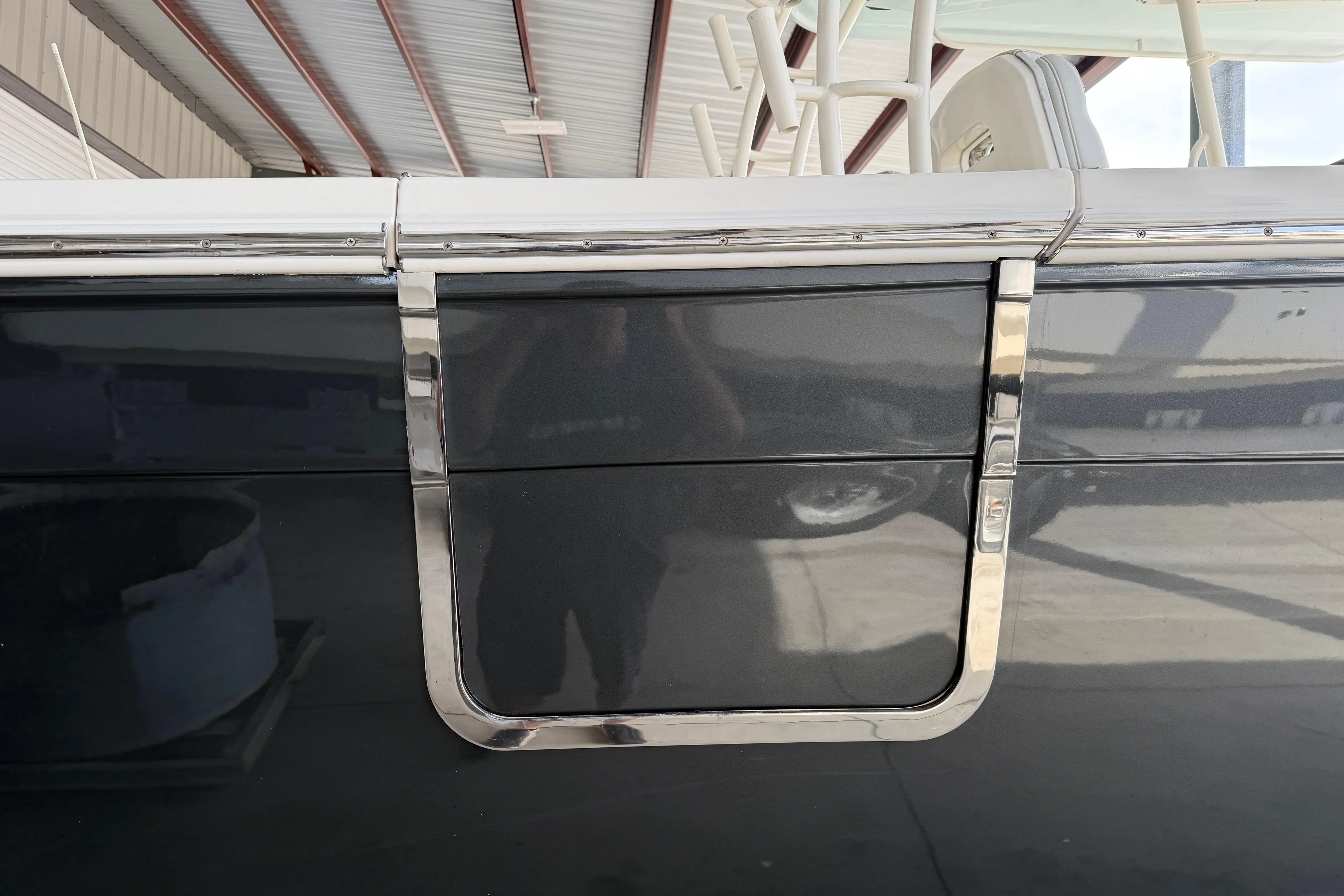 2015 Cobia 344 Center Console boat detail with sleek chrome accents.