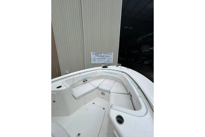 Yacht Photos Pics 2018 Robalo R302 Center Console boat interior with white seating and cup holders.