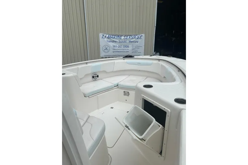  Yacht Photos Pics 2018 Robalo R302 Center Console boat interior with seating and storage.