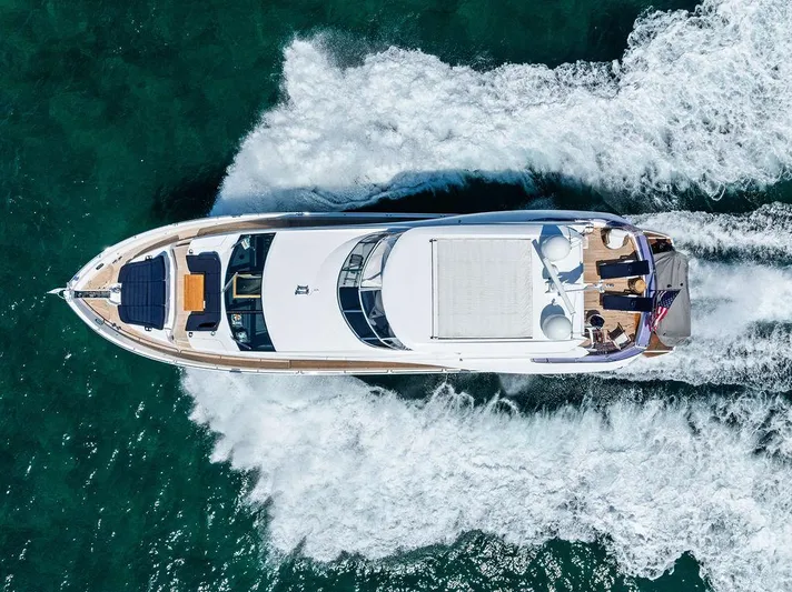 Sea Zar Yacht Photos Pics Aerial view of 2019 Sunseeker 86 Yacht cruising on open water.