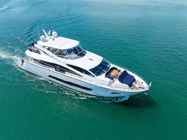 Sea Zar Yacht Photos Pics 2019 Sunseeker 86 Yacht cruising on clear blue waters.