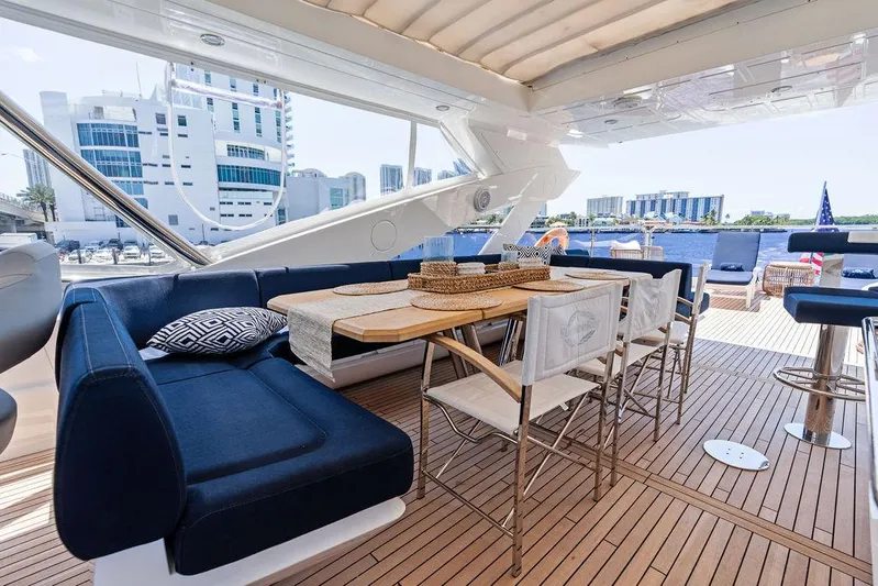 Sea Zar Yacht Photos Pics Luxurious Sunseeker 86 Yacht 2019 with elegant outdoor seating and dining area.