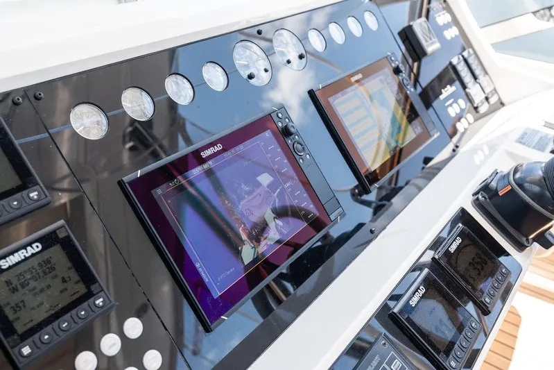 Sea Zar Yacht Photos Pics Control panel of 2019 Sunseeker 86 Yacht with navigation screens and gauges.