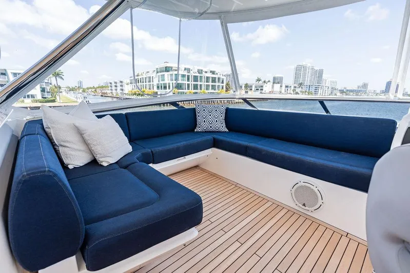 Sea Zar Yacht Photos Pics Luxurious Sunseeker 86 Yacht 2019 interior with blue seating and waterfront view.