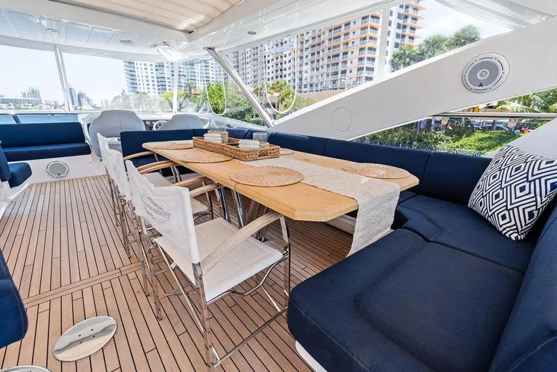 Sea Zar Yacht Photos Pics Luxurious Sunseeker 86 Yacht 2019 with elegant outdoor dining area and modern seating.