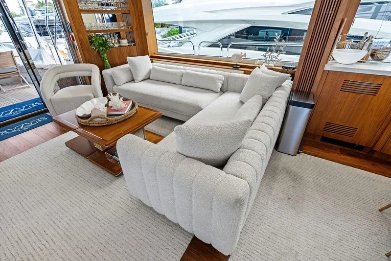 Sea Zar Yacht Photos Pics Luxurious interior of 2019 Sunseeker 86 Yacht with elegant seating and wooden accents.