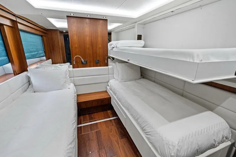 Sea Zar Yacht Photos Pics Luxurious cabin interior of 2019 Sunseeker 86 Yacht with modern wood and white decor.