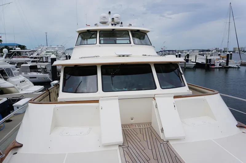 Novia II Yacht Photos Pics Luxury Marlow 66E yacht docked at marina, showcasing sleek design and spacious deck.