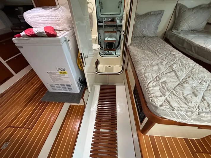Novia II Yacht Photos Pics Interior of 2020 Marlow 66E yacht with wooden flooring and cozy bedding.