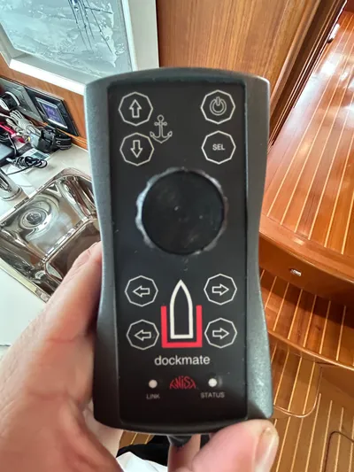 Novia II Yacht Photos Pics Remote control for Marlow 66E yacht, featuring directional and anchor buttons.