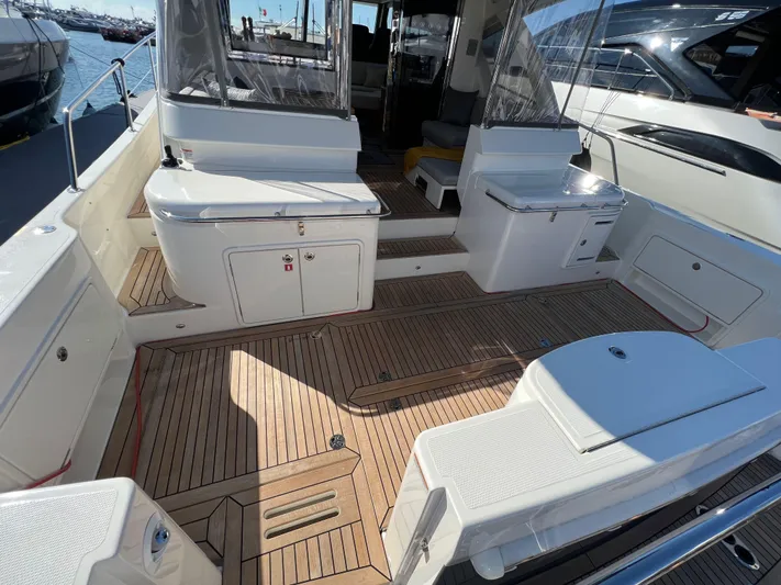 Scorpius Yacht Photos Pics Spacious deck of 2022 Riviera 505 SUV yacht with teak flooring.