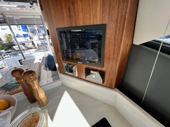 Scorpius Yacht Photos Pics Luxurious interior of 2022 Riviera 505 SUV yacht with modern kitchen amenities.