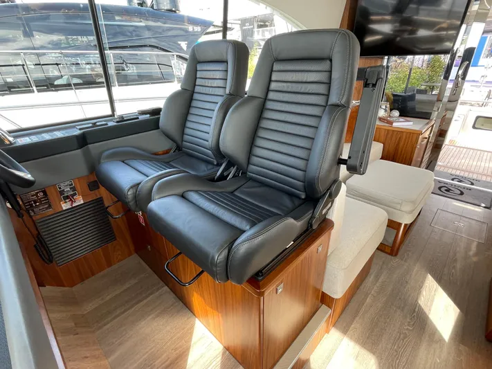 Scorpius Yacht Photos Pics Luxurious interior of 2022 Riviera 505 SUV with leather seating and modern design.