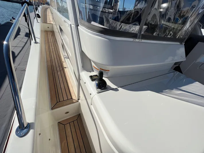 Scorpius Yacht Photos Pics 2022 Riviera 505 SUV yacht with sleek deck and modern design.