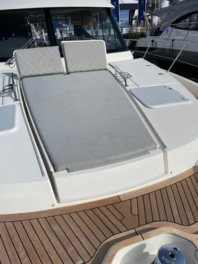 Scorpius Yacht Photos Pics 2022 Riviera 505 SUV yacht with sunbathing deck and luxurious seating.