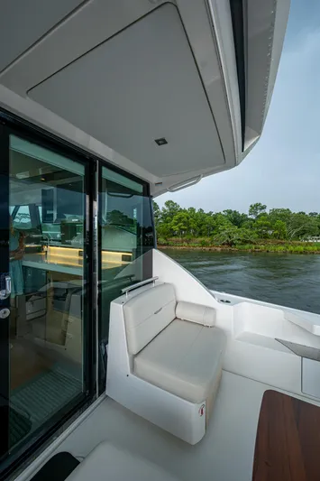  Yacht Photos Pics 2020 Tiara Yachts C44 Coupe, elegant seating area with scenic water view.