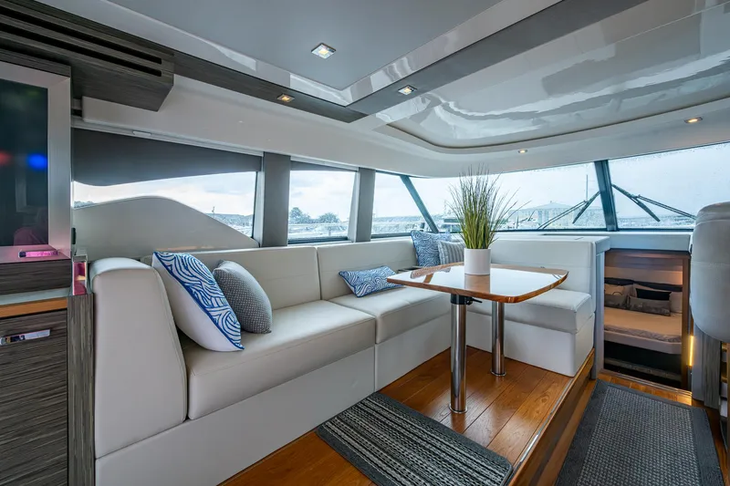  Yacht Photos Pics Luxurious interior of 2020 Tiara Yachts C44 Coupe with elegant seating and modern decor.